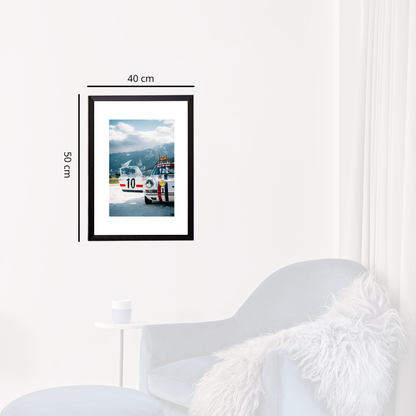Framed picture of a car on a wall with dimensions indicated