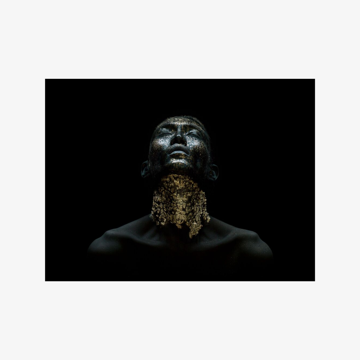 Man with a beard against a black background