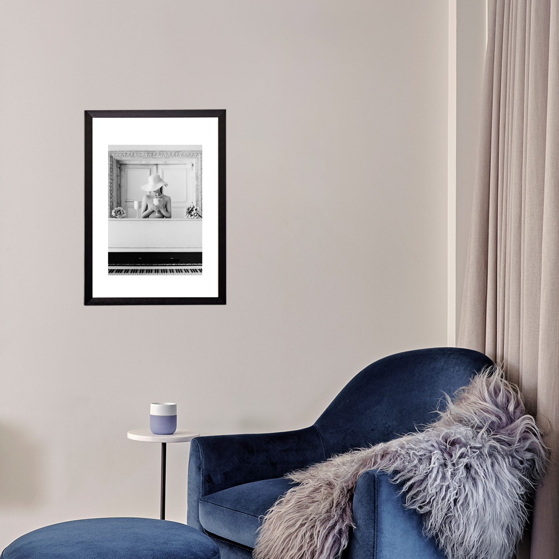 Blue armchair with a fur throw and a framed picture on the wall in a room.