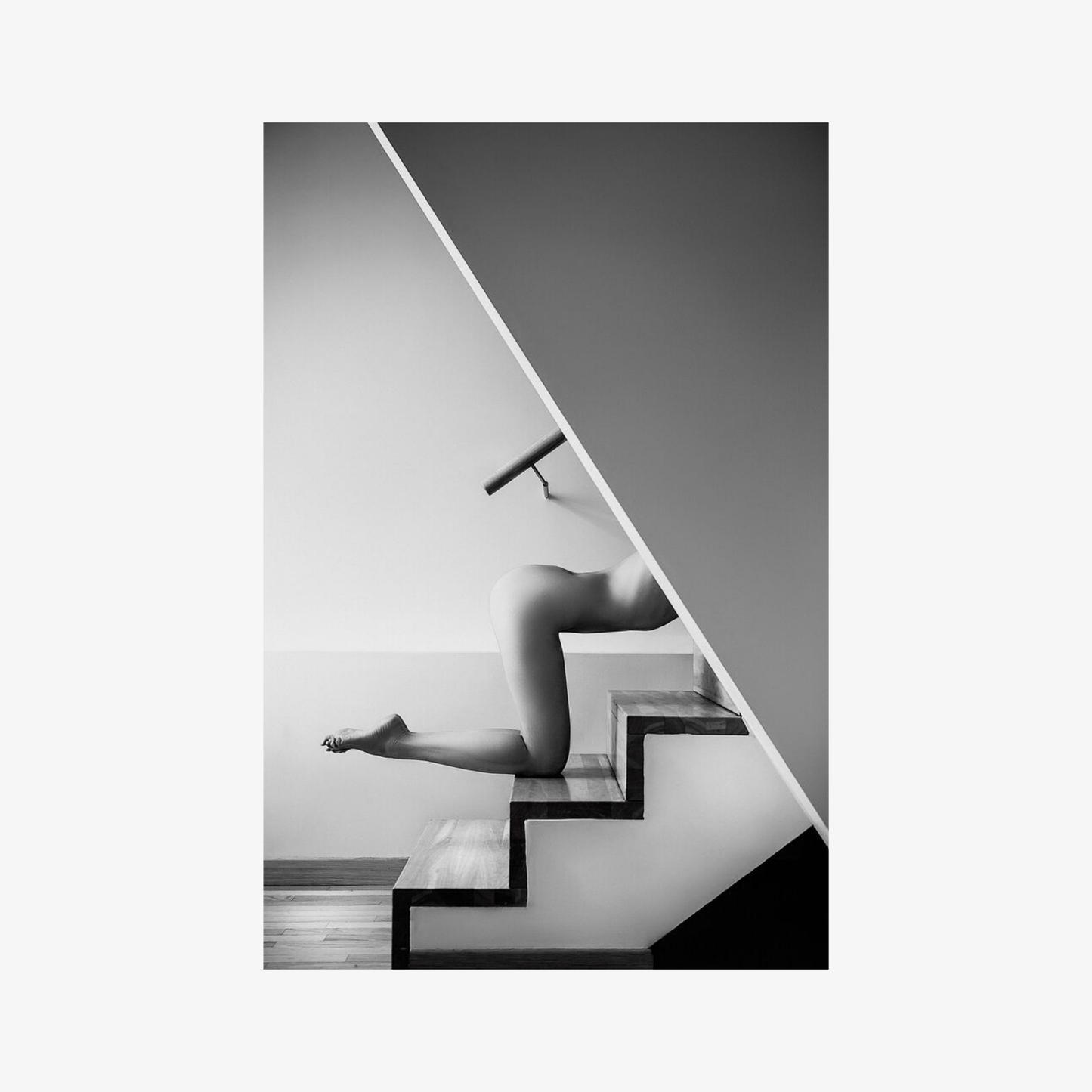 Person descending a modern staircase in a minimalistic setting