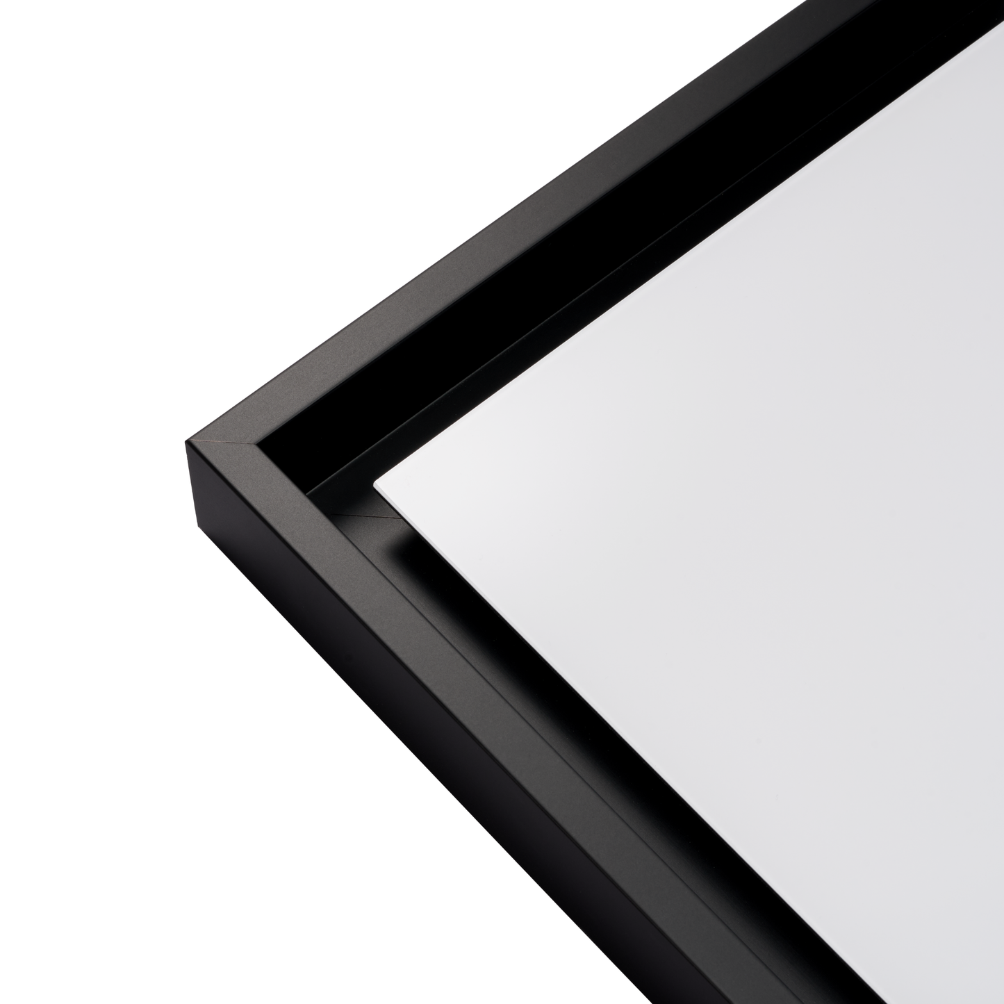 Close-up of a black-framed mirror on a white background