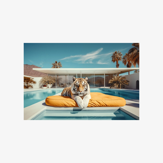 Tiger lying on a yellow cushion by a pool with palm trees and a building in the background