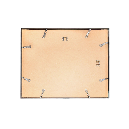 Back view of a picture frame with wooden backer and metal clips.