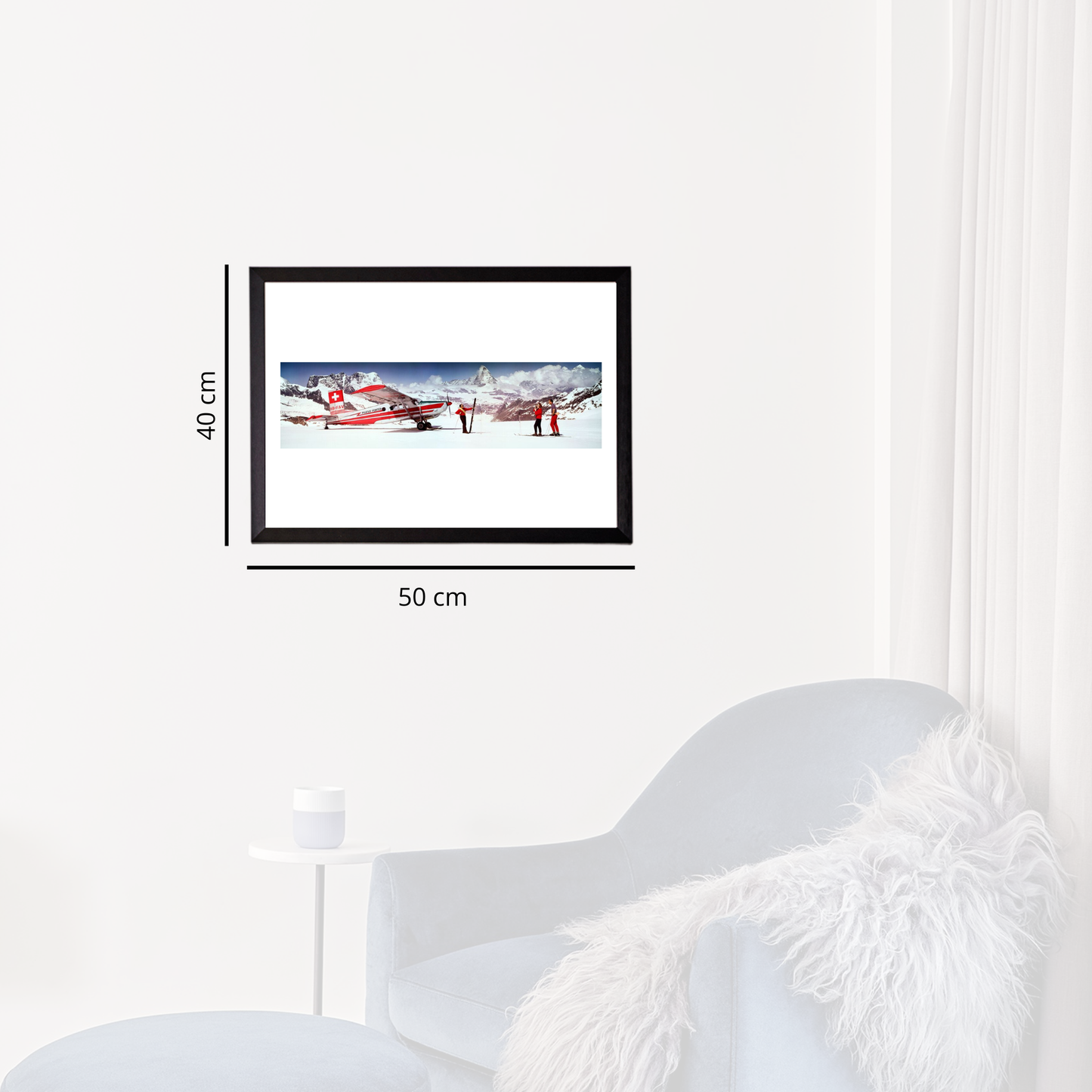Framed picture of a red airplane on a white wall with dimensions indicated.