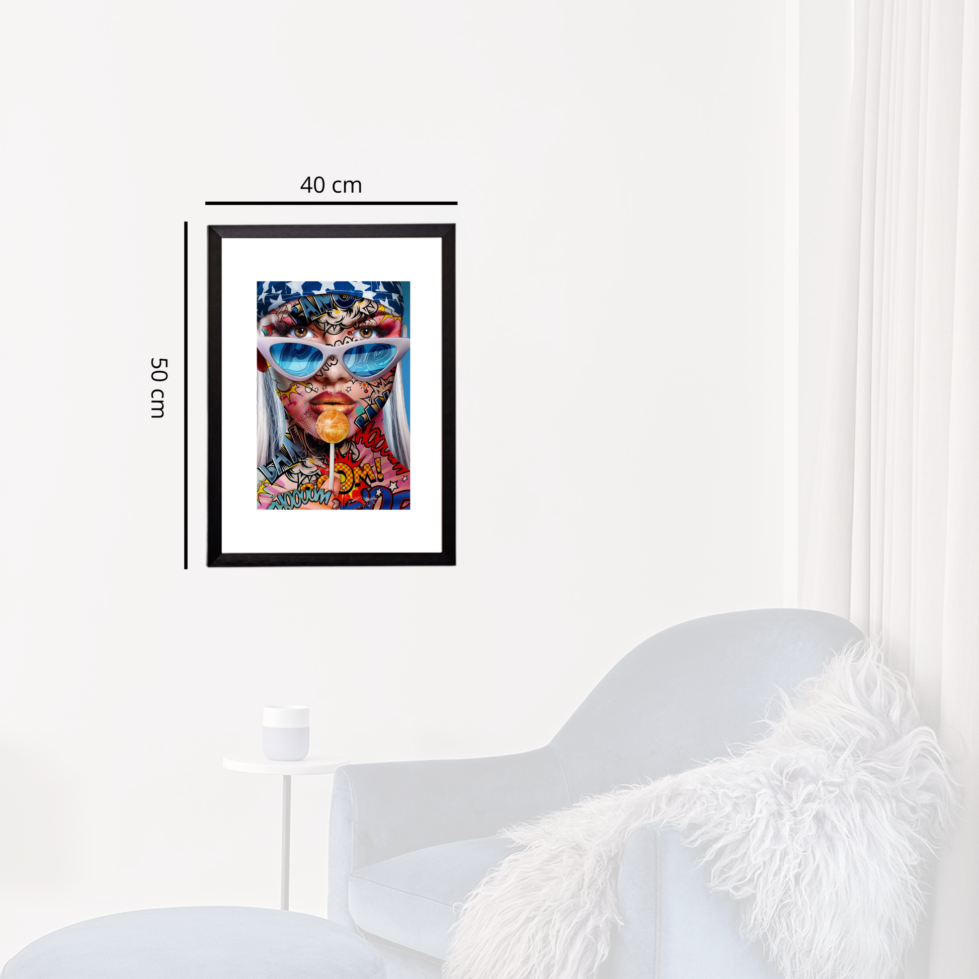 Framed artwork of a colorful face with sunglasses on a white wall.