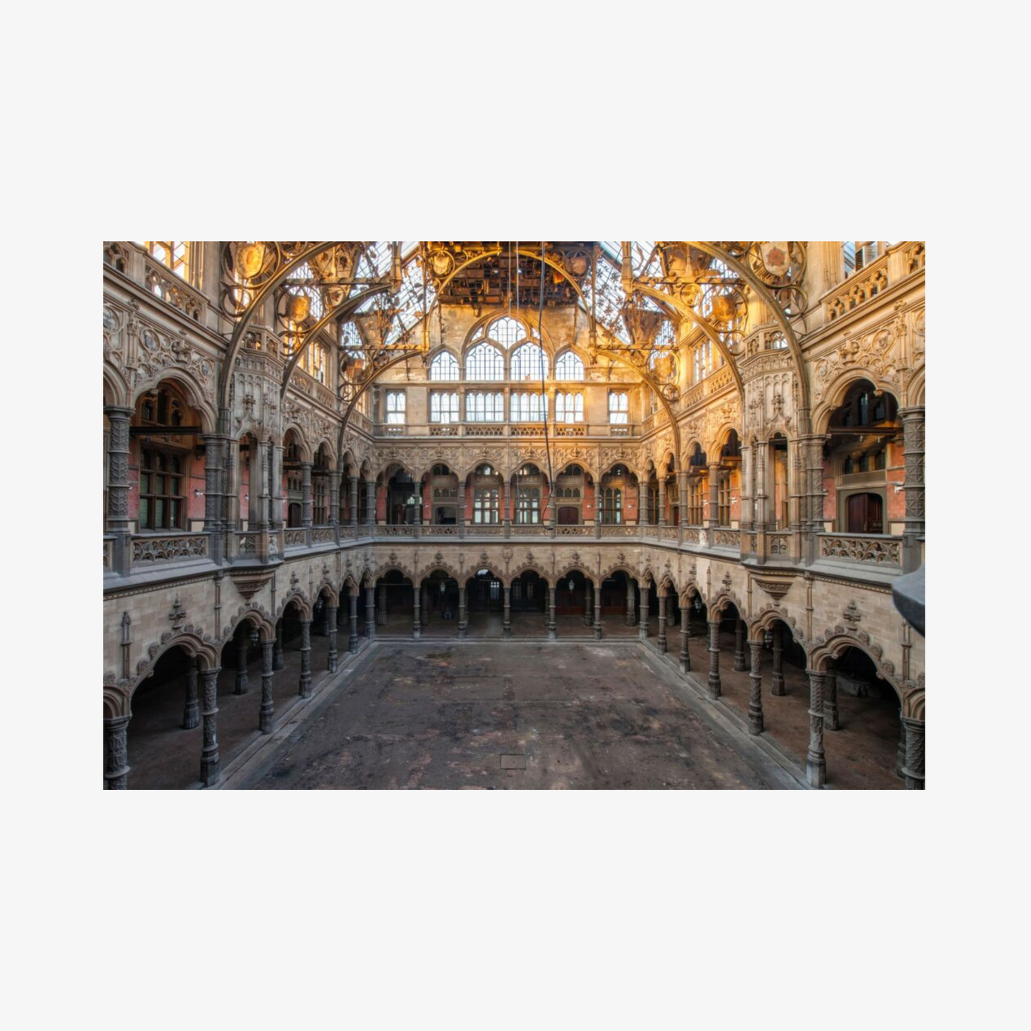 Large, ornate interior courtyard with high vaulted ceiling and arches.