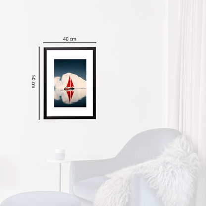 Framed artwork of a sailboat on water with measurements, displayed on a wall above a white chair.