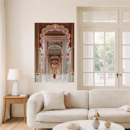 Living room with a large wall art depicting an architectural scene, a beige sofa, and a lamp.