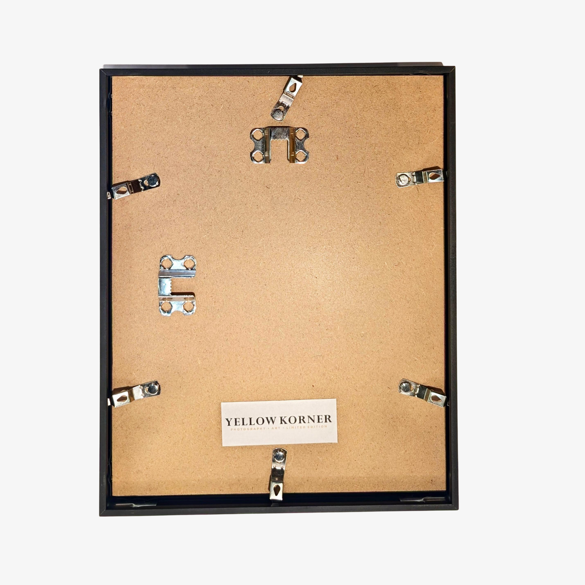 Back of a picture frame with 'Yellow Korner' label on a white background