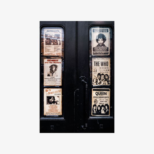 Vending machine with framed pictures of famous musicians on a white background