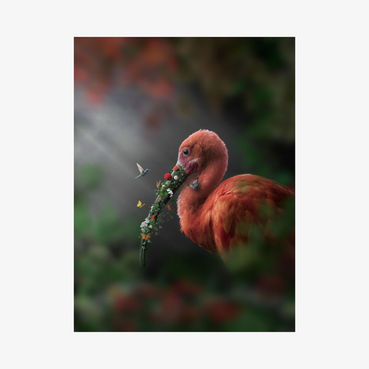 Flamingo with a branch in its beak against a blurred natural background
